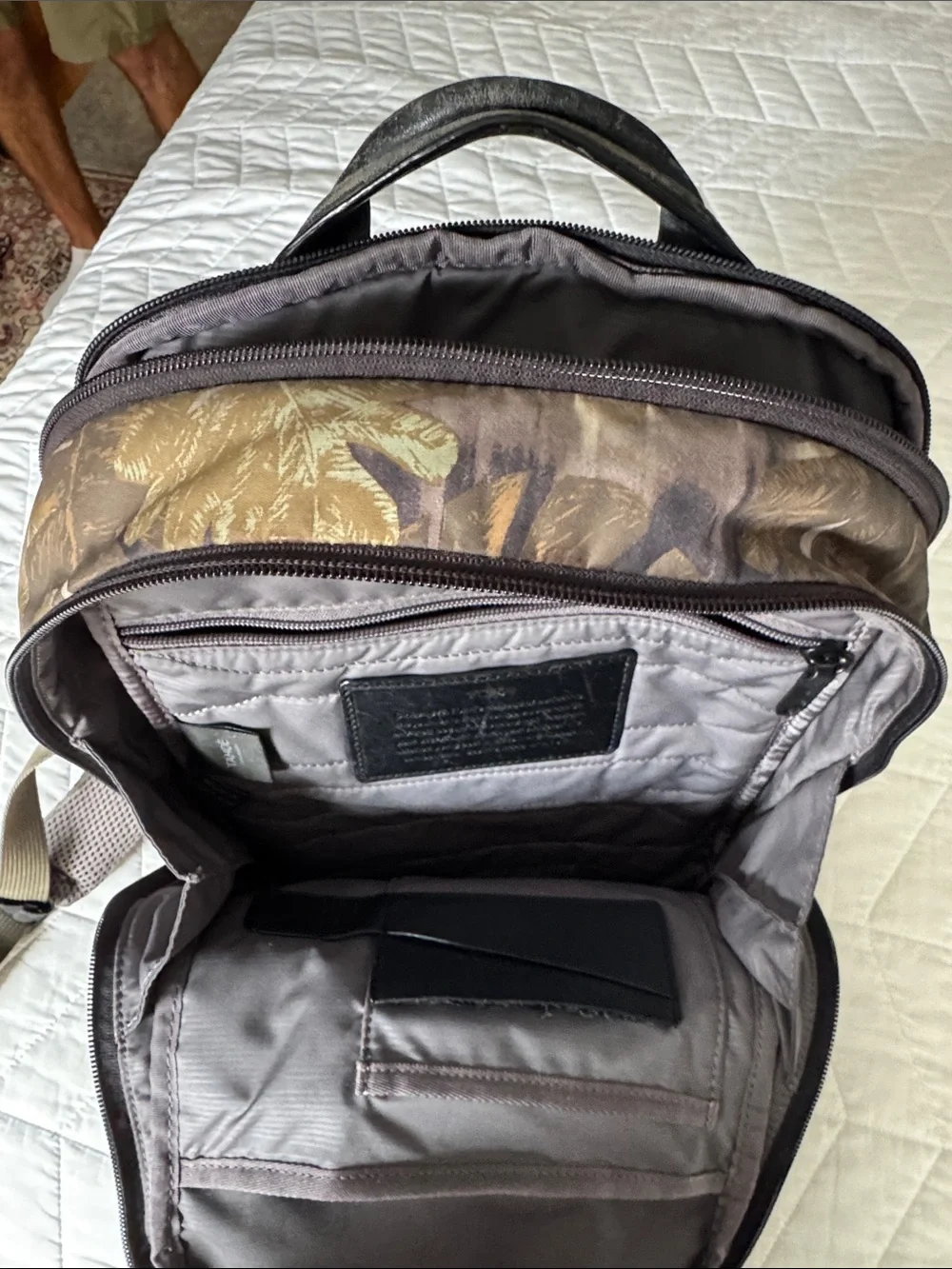 Tumi Black Leather and Brown Leaf-Print Backpack USED